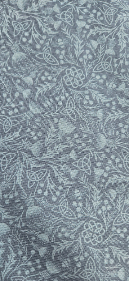 Lewis & Irene Celtic Thistle Duck Egg premium quilting cotton fabric featuring thistle motifs on a soft duck egg background.