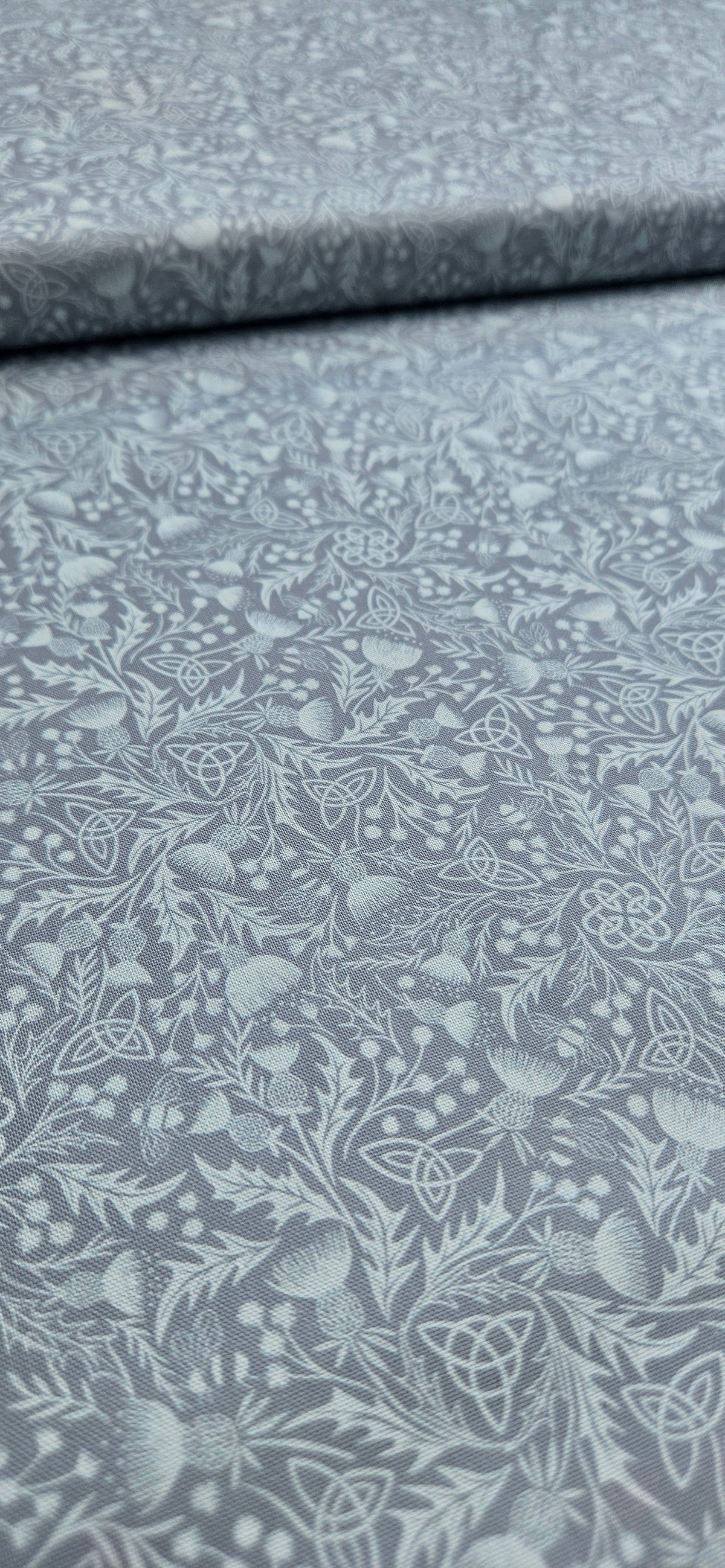 Lewis & Irene Celtic Thistle Duck Egg premium quilting cotton fabric featuring thistle motifs on a soft duck egg background.