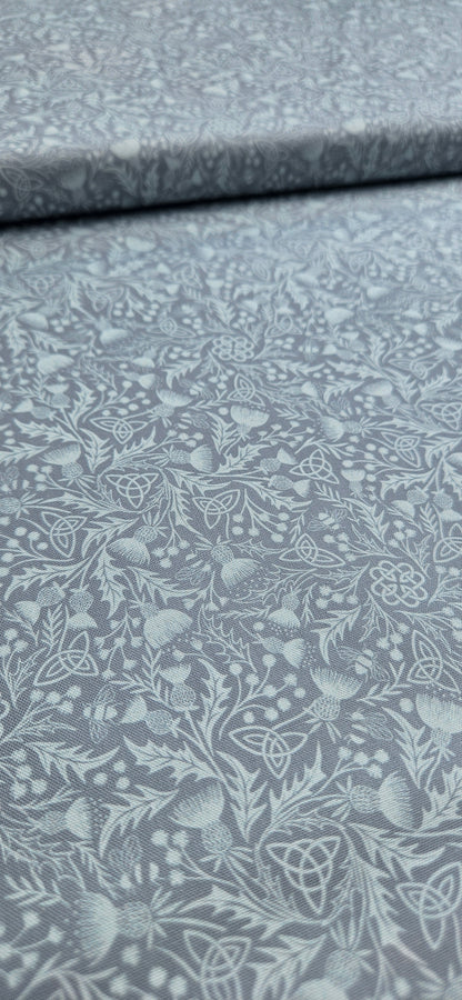 Lewis & Irene Celtic Thistle Duck Egg premium quilting cotton fabric featuring thistle motifs on a soft duck egg background.