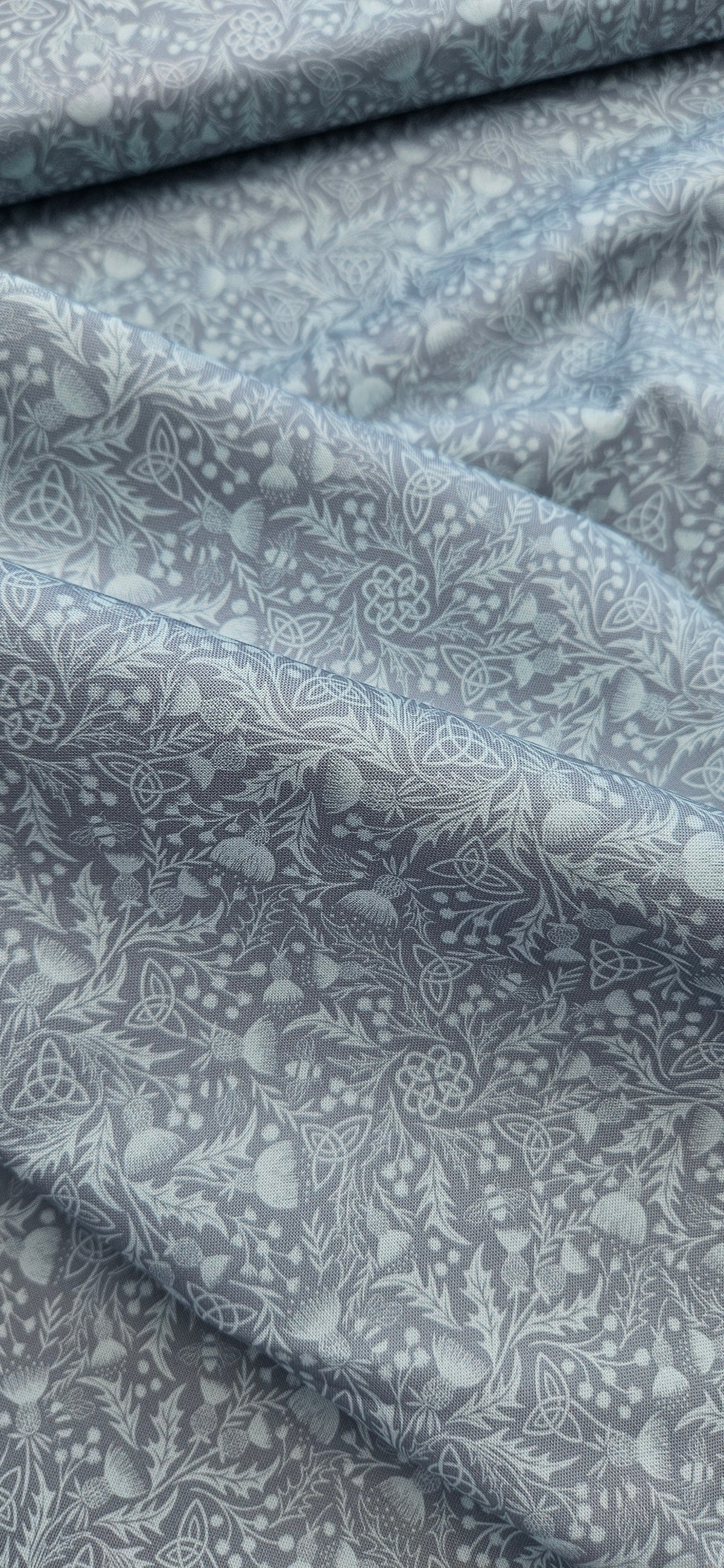 Lewis & Irene Celtic Thistle Duck Egg premium quilting cotton fabric featuring thistle motifs on a soft duck egg background.