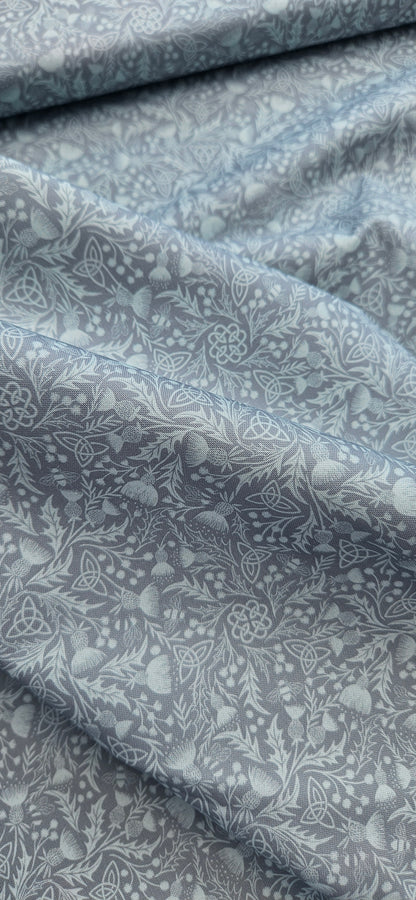 Lewis & Irene Celtic Thistle Duck Egg premium quilting cotton fabric featuring thistle motifs on a soft duck egg background.