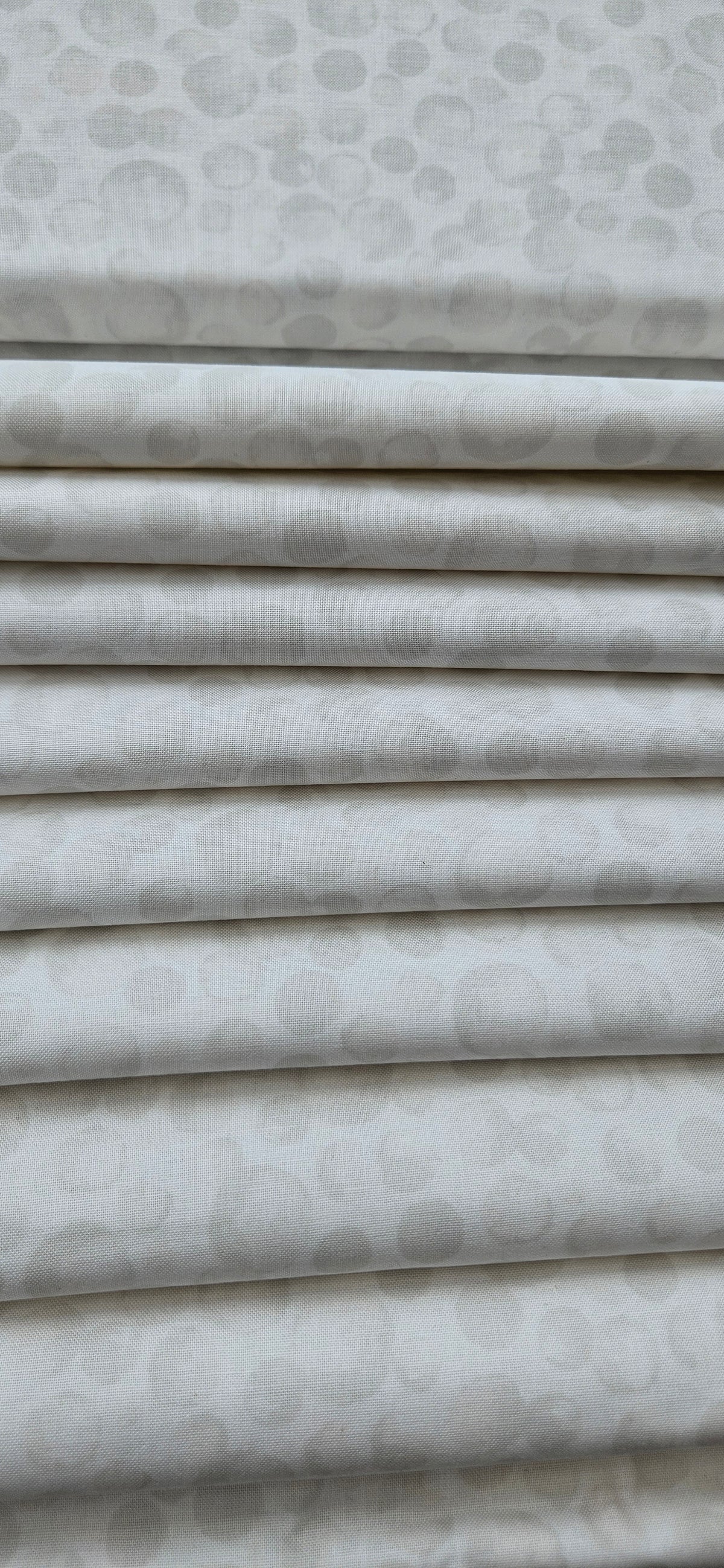 Lewis & Irene Bumbleberries White premium quilting cotton blender fabric with a subtle tonal design.