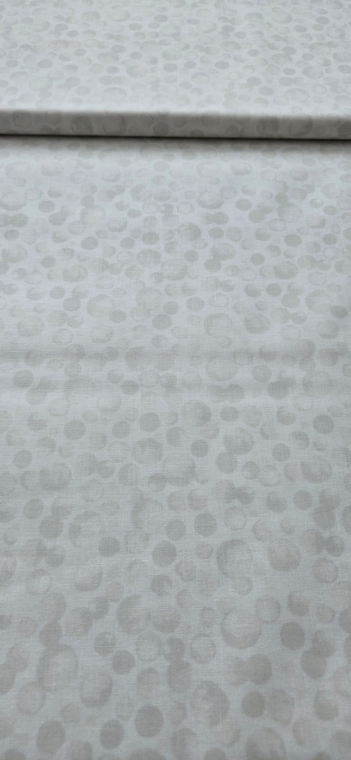 Lewis & Irene Bumbleberries White premium quilting cotton blender fabric with a subtle tonal design.
