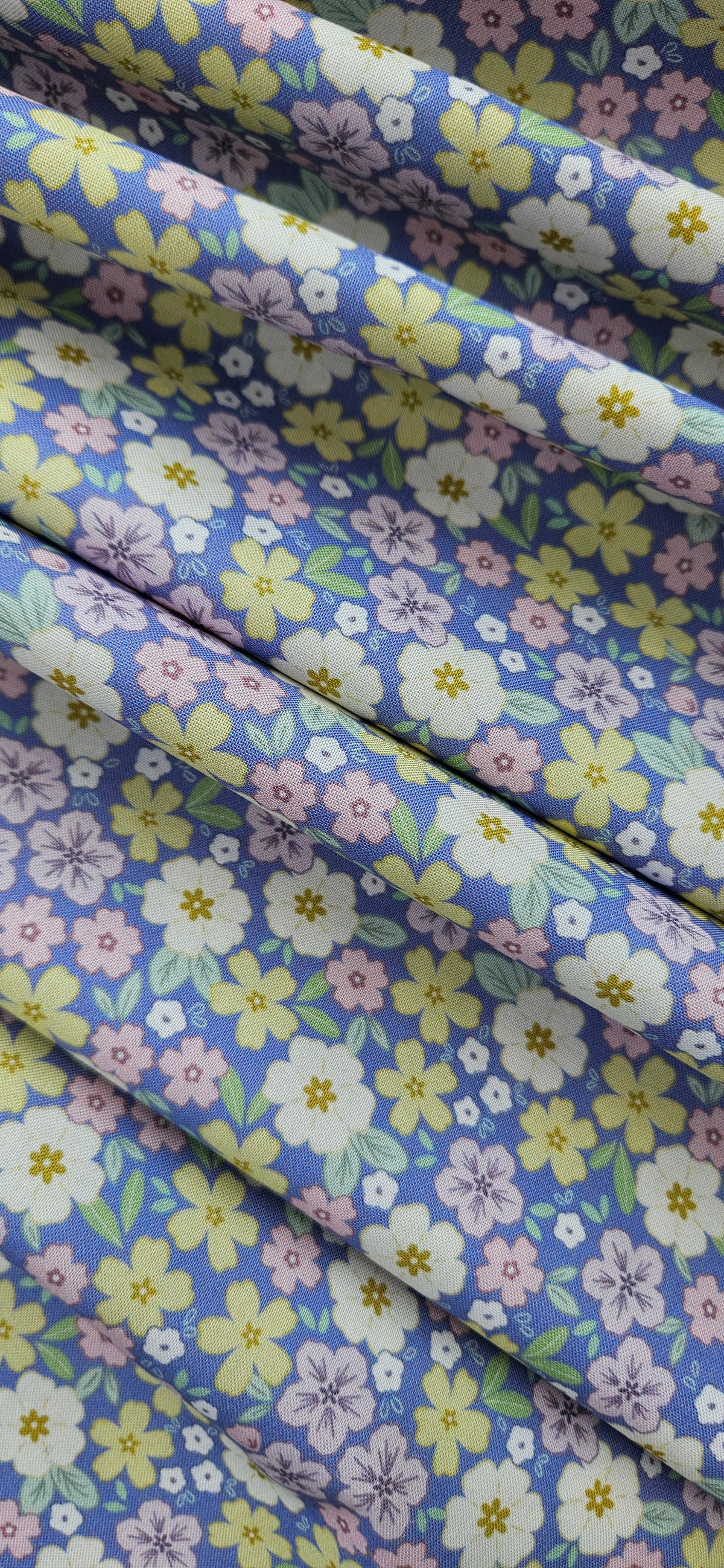 Lewis & Irene Dear Spring Primrose Prairie Dusky Mid Blue floral quilting cotton fabric by Cassandra Connolly.
