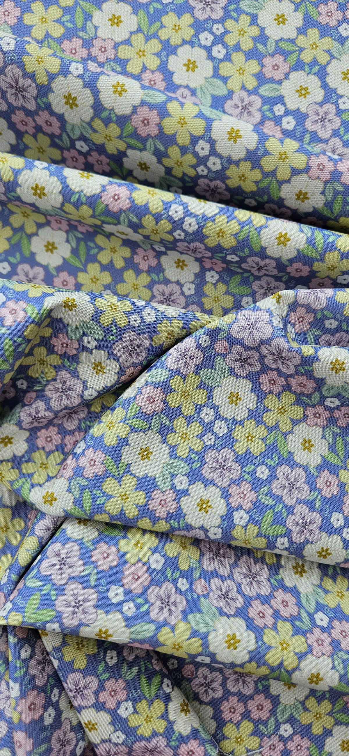 Lewis & Irene Dear Spring Primrose Prairie Dusky Mid Blue floral quilting cotton fabric by Cassandra Connolly.