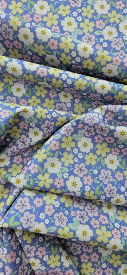 Lewis & Irene Dear Spring Primrose Prairie Dusky Mid Blue floral quilting cotton fabric by Cassandra Connolly.