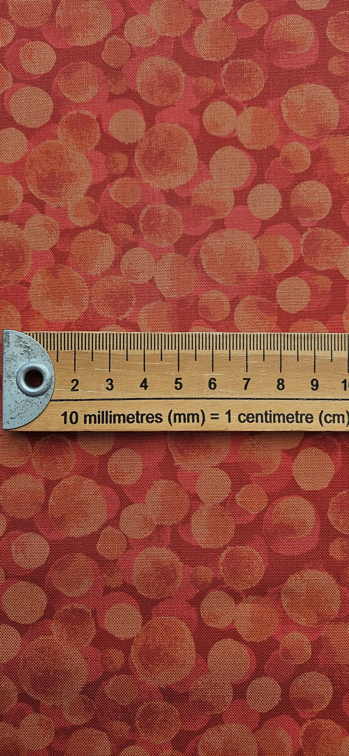 Lewis & Irene Bumbleberries Red Rust premium quilting cotton blender fabric in warm red and rust tones.