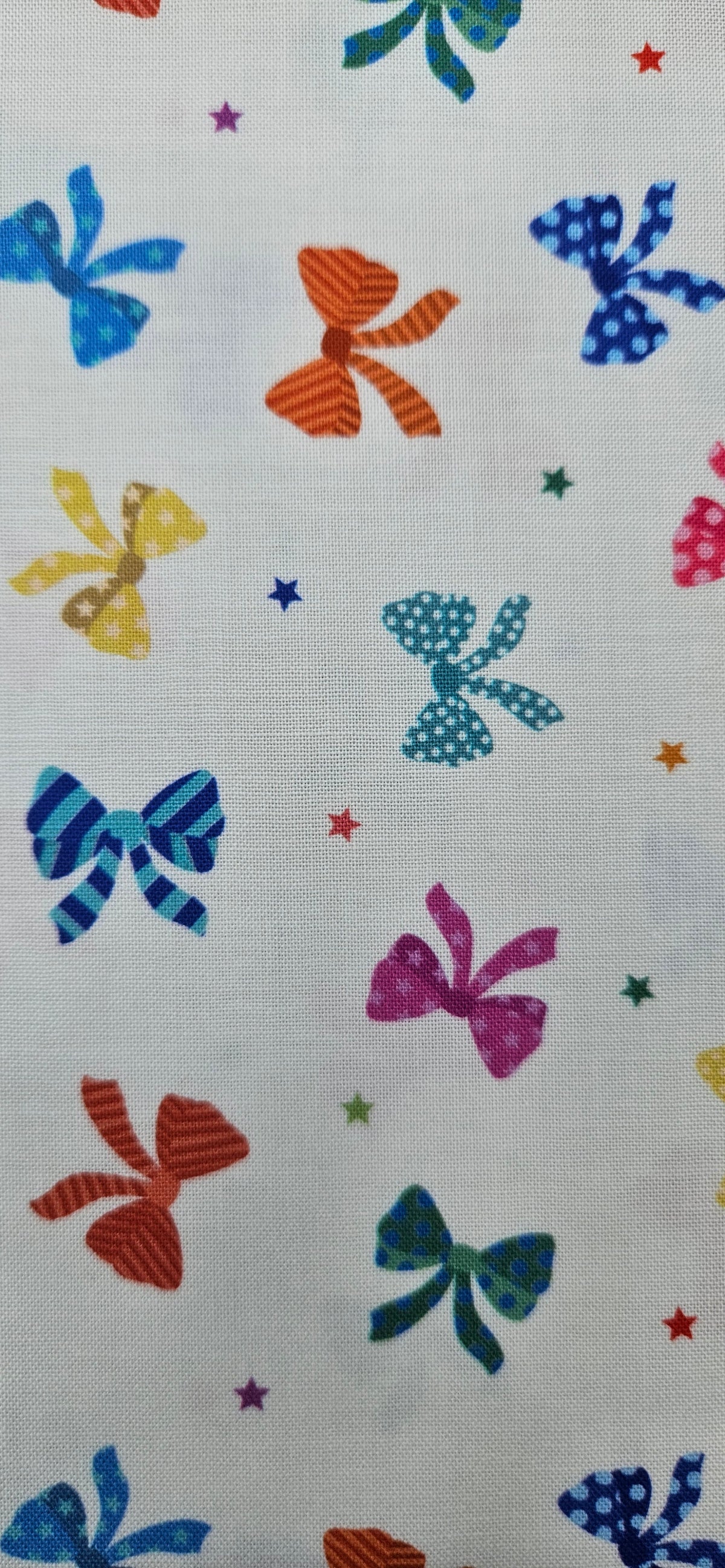 Lewis & Irene Small Things Celebrations Bows cotton fabric with colourful bows and stars on white