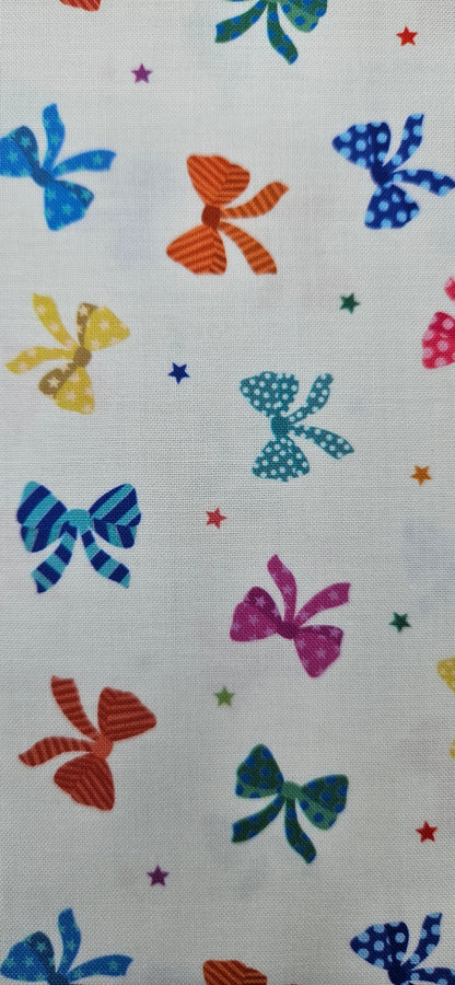 Lewis & Irene Small Things Celebrations Bows cotton fabric with colourful bows and stars on white