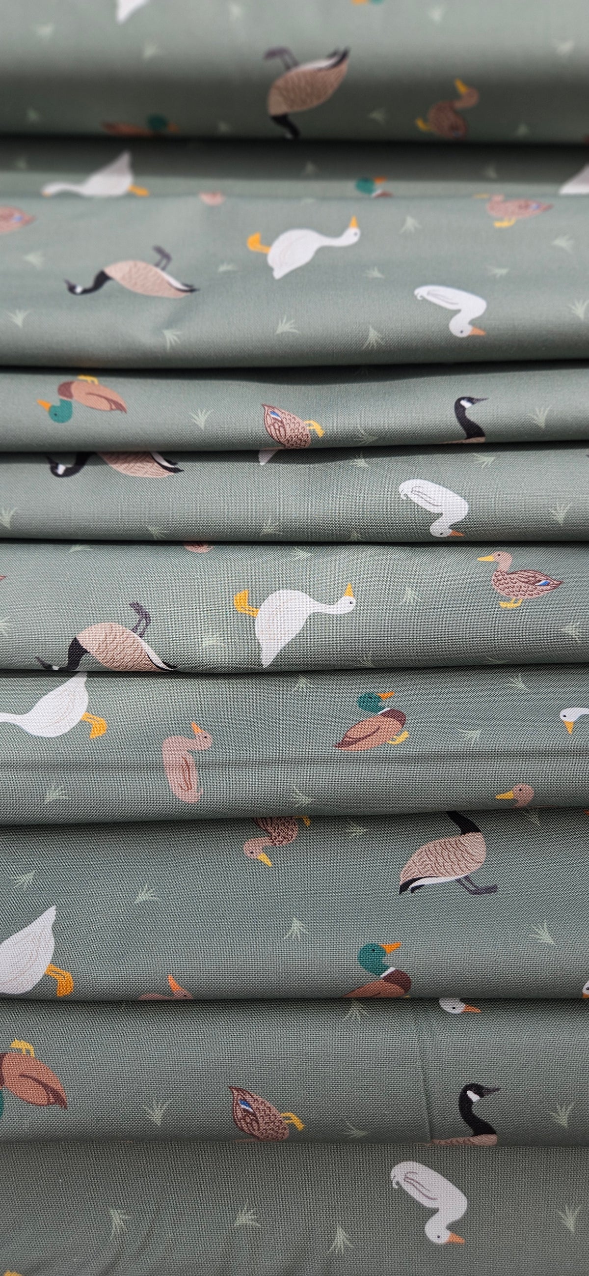 Lewis & Irene Small Things Rivers & Creeks Ducks and Geese on Green premium quilting cotton fabric.